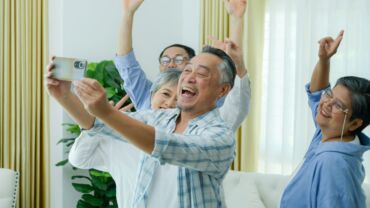 Image of a group of elderly people enjoying and having fun together