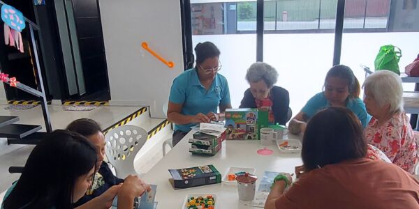 The elderly building Lego as part of motor skills activity